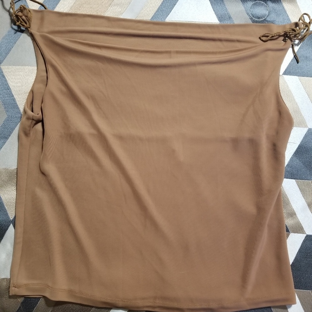 A TOTO brand tan sleeveless blouse